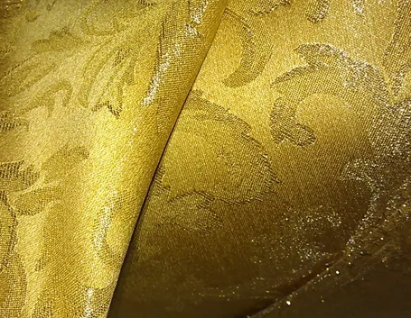 Tessuto damasco sui toni dell'oro